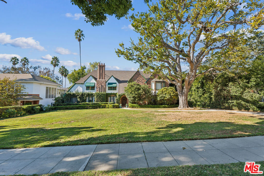 The Gloria Vanderbilt Estate. First time on the market in 72 years. Seldom does a residence on the best block on the best street in the Flats become available. This classic Beverly Hills estate has been graced by Hollywood's elite, formerly leased by Gloria Vanderbilt and then purchased by Noreen Nash, frequented by Elvis, Warren Beatty, Bob Evans, Ali McGraw and Henry Miller who was married at the estate. It is only fitting that the residence can host 400 guests for an elegant party or fundraiser, and accommodate 14 cars. This sprawling, nearly 30,000+ SqFt flat lot, privately framed by mature landscaping, boasts a massive pool, covered patio, and a guest house. Intentionally set back from the street, exuding magnificent grandeur, this traditional abode features a grand living room, impressive library, expansive primary suite and five additional bedrooms. Truly a once in a lifetime opportunity.