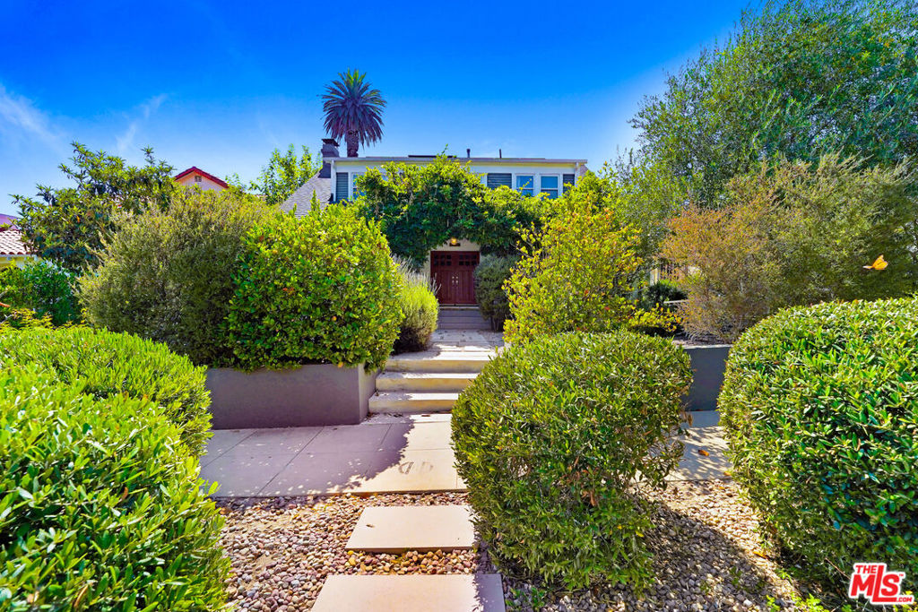 Welcome to this fully furnished Los Feliz retreat that harmonizes sophisticated design with discerning upgrades throughout its spacious two-story floor plan. Step inside to find an inviting living room complete with a cozy fireplace, formal dining room, and chef's kitchen, with stainless steel appliances, Carrera marble countertops and Cle tile mosaic floors throughout. A rear den with walls of glass opens to a deck where you can relax in the hammock, overlooking an immense saltwater pool, creating a seamless indoor-outdoor living experience. An office/bedroom and bathroom complete the main level. Ascend to the second story to discover four additional bedrooms, including the primary bedroom with en-suite bathroom with Carrera marble. Outside, enjoy your private outdoor haven featuring sparkling pool and hot tub, hardscape with outdoor kitchen and dining area, and native plantings including passion fruit and pomegranate trees. A converted garage studio provides additional bonus space on this expansive 6,500 square ft lot. 2 car driveway parking, two-zone air conditioning, updated plumbing, and a solar panels to help lower bills. Located just minutes from Griffith Park, the Greek Theatre, Franklin Village, Hillhurst Ave, and iconic spots like Little Dom's, All Time, Maru Coffee, Skylight, and the Alcove.