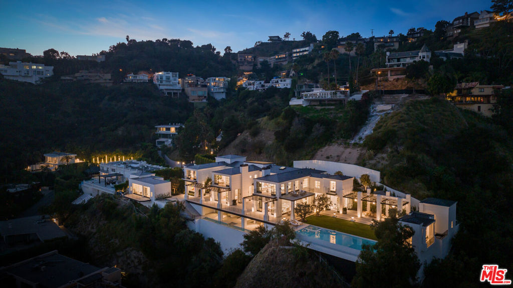 One of the most important estates ever built in the Hollywood Hills, located at the end of a cul-de-sac in the prime Bird Streets. An extraordinary blend of taste, quality and craftsmanship, impossible to replicate and featuring every conceivable amenity. Completely private and secluded behind gates, enter into a world amongst itself. Stunning 2-story entry with sweeping staircase, a spectacular living room, gourmet kitchen/family room, formal dining room, separate chef's kitchen, media/theater, and library/office, all overlooking the incredible grounds, courtyards, lawns, and breathtaking city views. Absolutely amazing primary suite with large sitting areas, gorgeous baths and walk-in closets. There is a full spa, including gym, sauna, cold plunge and lap pool. Beautiful estate-like grounds feature outdoor kitchen, dining, infinity pool, pickle ball court, and wonderful areas for large scale entertaining. An incredible opportunity to acquire a trophy view estate. Shown to pre-qualified clients only.