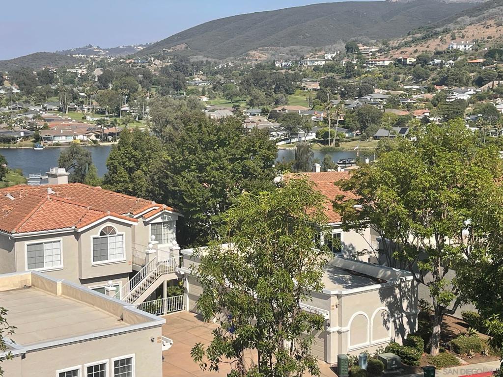 Wake up to a cup of joe while enjoying beautiful lake and mountain views . This lovely 2 bedroom upper unit condo has as an open floorplan with cozy eat-in kitchen, formal dining area and a 3rd room/office, cozy fireplace in living room, access from MB to patio, convenient two car garage. Lake San Marcos is North County's best kept secret! Close to shopping, golf, restaurants and community center. Enjoy the community (HOA) pool and clubhouse on a hot summer day, plenty of guest parking for friends and family when they visit. No age restrictions. Million dollar views without the Million dollar price tag. Sold AS IS, NO REPAIRS