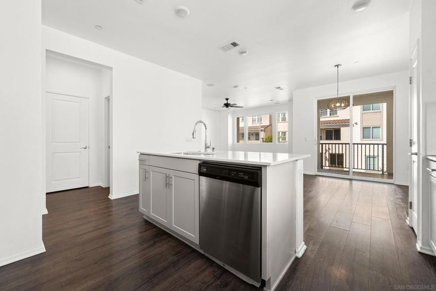 Welcome to this beautifully built (2017) corner-unit townhome, offering privacy and comfort with only one shared wall. Spread out across three levels, the main living floor features an open-concept layout with a modern kitchen, dining area, and a convenient half bath. Step out onto the second-floor balcony for fresh air and relaxation.  Upstairs, you'll find three spacious bedrooms and two full bathrooms, perfect for families or roommates. The kitchen is equipped with sleek quartz countertops and a full suite of stainless steel appliances. Enjoy the convenience of nearly instant hot water with an energy-efficient tankless water heater.  The attached 2-car garage provides ample space for parking, storage, or even a home gym or office setup.  Community amenities include a large pool, recreation room, BBQ area, dog park, and more—ideal for an active lifestyle.  ?? Pet Policy: Pets allowed with restrictions ?? Rental Terms: No Airbnb or short-term rentals permitted  This is a rare rental opportunity in a sought-after community—schedule your tour today before it's gone!