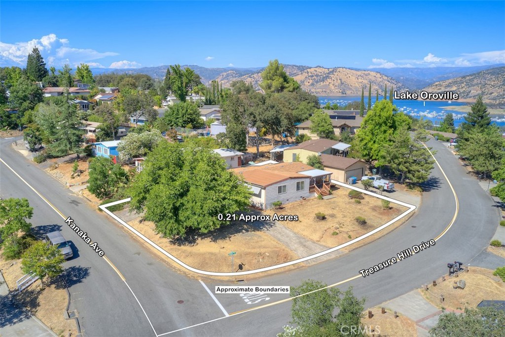 Home by the Lake – Kelly Ridge Opportunity!
Great buy on this spacious 1,800 sq. ft. manufactured home situated on a 0.21-acre corner lot perched above Lake Oroville! This 2-bedroom, 2-bath home features a welcoming open floor plan with a bright and airy living room, a large dining area, and a well-designed kitchen with plenty of counter space and cabinetry.
The oversized primary suite offers a relaxing retreat with its own private bathroom, while the guest bedroom and full guest bath provide plenty of space for family or friends. An attached storage room adds convenience and functionality, and you can even enjoy peekaboo views of the lake from the property.
The easy-to-maintain landscaping and prime corner lot make this home a great low-maintenance option. You’ll love the peaceful setting, where local deer often roam the ridge, and the location is just minutes from Lake Oroville’s marina and the golf course.
Come see why this charming Kelly Ridge property is the perfect place for affordable living by the lake!