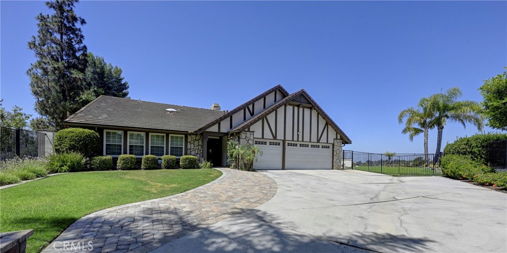 Welcome to your dream home! Tucked away at the end of a peaceful cul-de-sac, this beautifully maintained single-story pool gem offers the perfect blend of comfort, style, and functionality. With 4 spacious bedrooms and 2 full bathrooms, this residence is designed to impress from the moment you walk in. Enjoy soaring ceilings, abundant natural light, and a cozy fireplace in the expansive living room that seamlessly flows to the stunning backyard—perfect for entertaining or unwinding. The large kitchen is a chef’s dream, featuring granite countertops, a generous island, and ample cabinetry, with direct access to a charming California room ideal for outdoor dining and gatherings. This home also offers two dining areas, one next to the kitchen with amazing views and the large formal dining room with enough room to expand your table to accommodate your guests for the holidays? The primary suite is a true retreat with custom built-ins, outdoor access, and serene views. The en-suite bathroom offers dual vanities, a soaking tub, separate shower, and a spacious walk-in closet. Three additional bedrooms provide flexibility—one of which includes a Murphy bed and built-ins, making it ideal for a home office or guest space. Natural light pours in through multiple skylights, expansive windows, and sliding doors that frame picturesque sunset views. Step outside to your private backyard oasis—complete with a sparkling pool, built-in BBQ with fridge and sink, lush grassy areas, and a large covered patio perfect for relaxing or entertaining. Additional features include a three-car garage with plenty of space for vehicles, storage, or even a home gym. Situated on a rare ½+ acre lot in a prime location, this is the one you've been waiting for. Don’t miss out on this exceptional opportunity! Located in the top-rated Placentia-Yorba Linda School District, near golf courses, Trader Joe’s, Home goods, Savi Ranch shopping area (Costco and Home Depot), parks, hiking trails, groceries stores, and Yorba Linda Town Center—and no HOA.