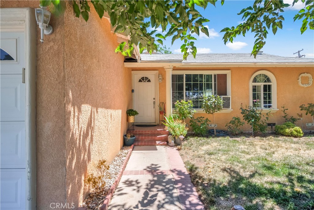 Welcome to this move-in ready single-story home offering comfort, style, and functionality in the heart of Palmdale. Featuring 4 spacious bedrooms and 2 bathrooms across 1,278 sq ft of living space, this residence sits on a generous 7,248 sq ft lot, providing plenty of room to live, relax, and entertain. Step inside to an open floor plan highlighted by crown molding, ceiling fans, and abundant natural light streaming through double-pane windows. The living room flows seamlessly into the dining area and a remodeled kitchen complete with granite countertops, a large kitchen island, pots & pan drawers, and stainless steel appliances including a dishwasher, gas cooktop, microwave, and refrigerator. The bathrooms feature modern upgrades such as a walk-in shower and shower-in-tub combination. All bedrooms are conveniently located on the main floor, with the primary suite offering a private retreat and direct access to its own bath. Outdoors, enjoy both a covered patio and deck, perfect for summer barbecues or relaxing evenings. The large front and backyard are secured with brick and wrought iron fencing, offering privacy and security. The attached 2-car garage and RV parking potential add valuable convenience. With additional features like tile flooring throughout, mirrored closet doors, and gated parking, this home is move-in ready. Located in a friendly neighborhood with sidewalks and close proximity to schools, parks, and shopping, it’s the perfect blend of comfort and practicality. Don’t miss the opportunity to make this Palmdale gem yours — whether you’re a first-time buyer, upgrading for more space, or looking for a great investment. Schedule your private showing today!
