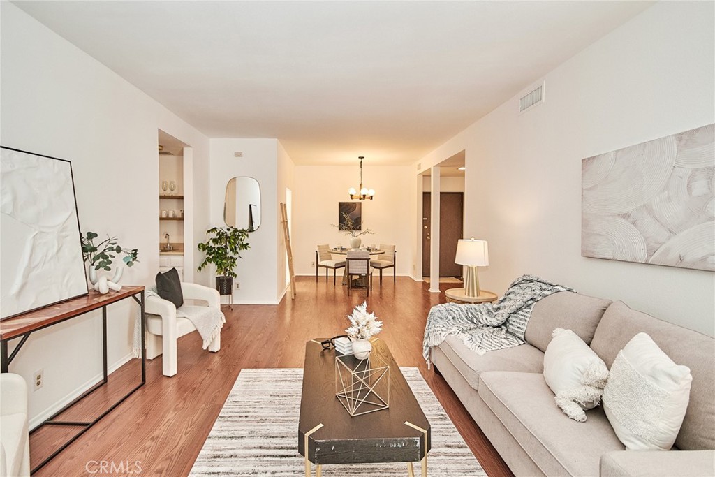 Welcome to your peaceful oasis in the highly sought-after Wilson Summit community—where comfort, style, and convenience come together. This spacious and cozy 2-bedroom, 2-bathroom condominium offers the perfect blend of urban access and serene living, just minutes from Downtown Los Angeles, Old Town Pasadena, and the USC Health Sciences Campus. Step into a spacious living room with a cozy fireplace. A sliding glass door opens to your own garden-view patio, the ideal spot to enjoy your morning coffee or unwind in the evening. The open and functional floor plan includes a wet bar, with fresh paint throughout. The bedrooms are both en-suites, each with its own good sized walk-in closet and brand new carpeting, offering privacy and plenty of storage. Additional conveniences include in-unit laundry with washer and dryer included, refrigerator, and two secured parking spaces—one equipped with an EV charger. The Wilson Summit community is known for its lush, landscaped courtyards, breezy walkways, and resort-style amenities including a pool, spa, and sauna. With secured entry and easy access to the Gold Line, fine dining, shopping, and vibrant city life, this home is a rare find in a prime location.