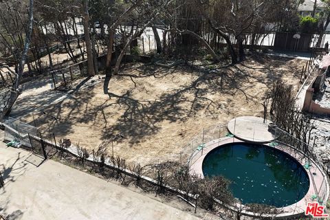 Photo of 909 Rivas Canyon Road, Pacific Palisades, CA 90272 (MLS # 26651927)