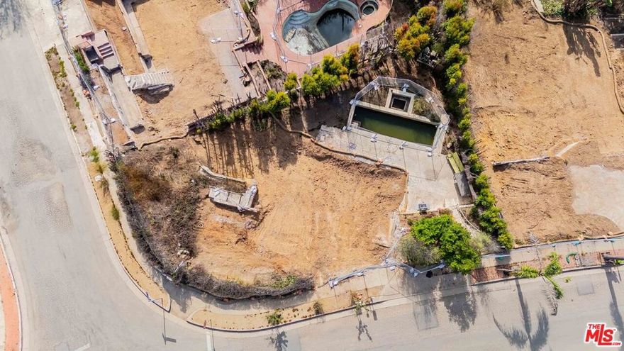 Welcome to 854 Las Lomas Ave, a prime Palisades development opportunity on the corner of Las Lomas and Alcima. This oversized 7,348 sq ft corner lot sits among surviving $10M+ estates on Alcima, and offers over 100 feet of frontage for incredible curb appeal. Mature trees wrap the property in beauty and near-total privacy, while abundant natural light and a small ocean view elevate its setting. The property comes with a full survey, soils reports, and new architectural and engineering plans for a 3,657 sq ft residence available upon request. It also qualifies for the Palisades "fast-track" 110% rebuild program, allowing expedited permitting of a 2,400 sq ft home. The lot's generous proportions allow for a spacious residence with seamless indoor-outdoor living, gardens, and pool potential all while maintaining seclusion and charm. Ideally located close to Palisades Village, top schools, boutique shops, dining, and the beach. This is an exceptional opportunity to create a custom estate in the heart of the Palisades, perfect for an owner-user or developer. Seller financing may be available.