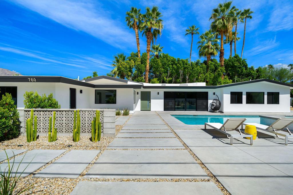 Down-to-the-studs renovation blends classic mid-century bones with modern design. This 4 bedroom, 4 bath home (including a full ADU) offers incredible mountain views and a spacious open floor plan that flows seamlessly to a resort-style backyard with pool, spa, and multiple lounge areas.The main home features timeless mid-century lines enhanced with contemporary finishes, while the ADU provides a fully self-contained living space--perfect for guests, multi-generational living, or rental income. Each bedroom is generously sized with access to beautifully updated baths, offering both comfort and flexibility.Located within walking distance to top restaurants and minutes from downtown, this property delivers quintessential Palm Springs living. Eligible for short-term rental, it's an ideal blend of iconic style, modern upgrades, and strong investment potential.