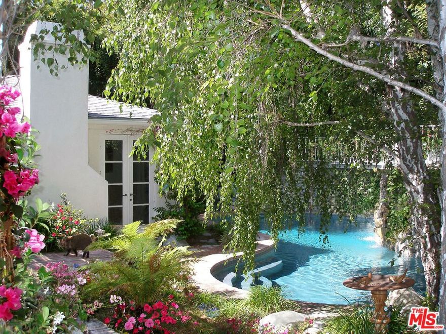 Private and gated romantic getaway just above the world-famous Chateau Marmont. Located on a celebrity block, this entertainment friendly home is only 2 minutes away from everything but feels like miles away. A perfect hideaway. Fireplaces in living, primary bedroom, and family room. Double French doors throughout open to arbor covered patio, lush gardens, sexy rock walled pool with waterfall and a private spa. An enchanting garden walkway leads to the upper deck. The 3rd bedroom is really a great family/media room or large home office. Entertain in style. Property is minutes away from all varieties of restaurants, coffee houses, clubs, bars and all the famous Sunset Blvd & West Hollywood have to offer.