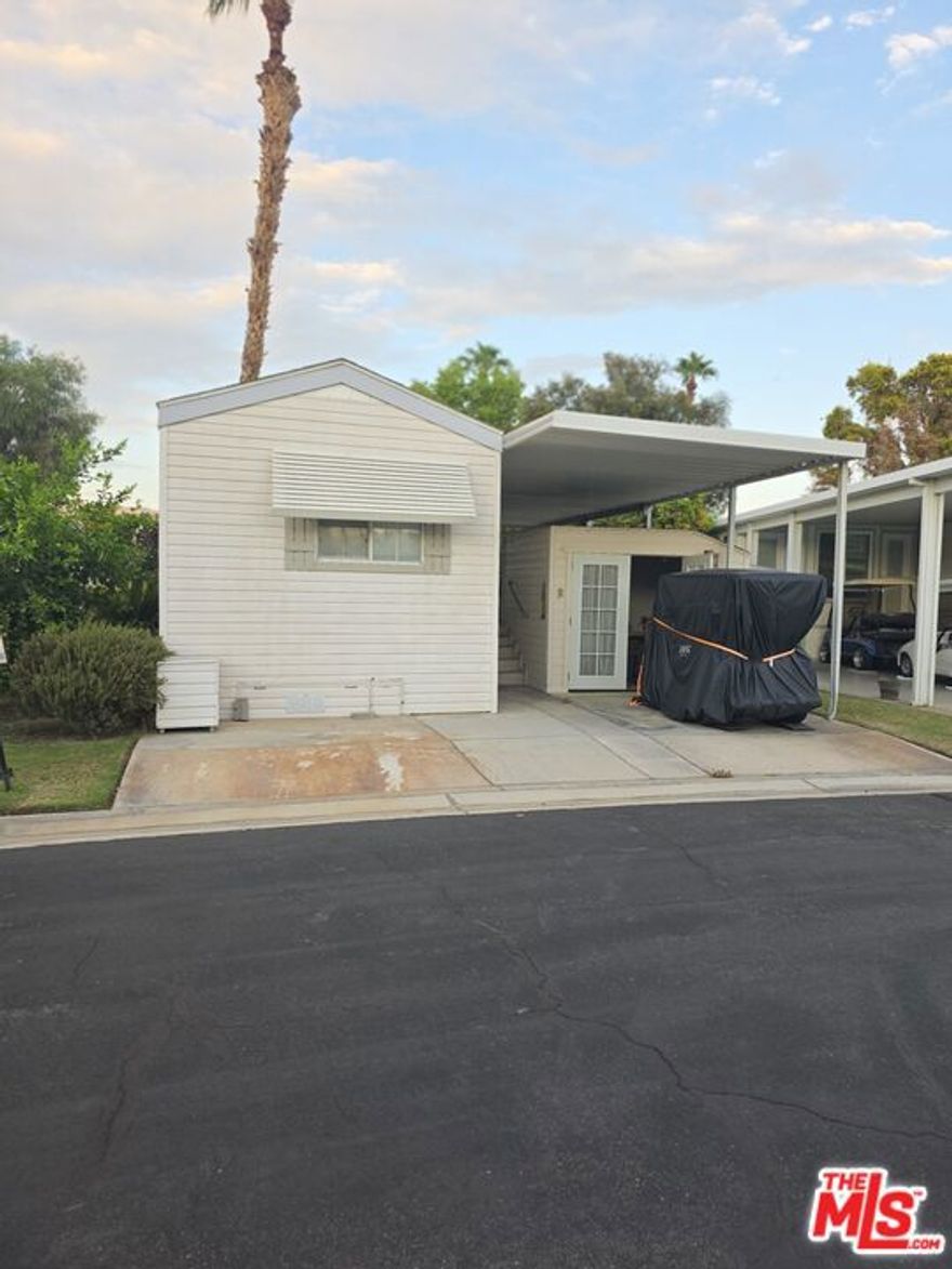 This '91 Fleetwood has upgraded laminate and carpet flooring. Newer furniture and with new full size refrigerator. Decorated to create a peaceful atmosphere. Wider than normal deck to entertain a nice dinner party as it overlooks the quiet green belt and gazebo in Old Town. The oversized shed houses the washer and dryer and provides extra storage space. This all located in a 55+ community that has a 3 par golf course, chipping green, putting green, 9 hole mini golf, pickleball and tennis courts, bocce ball, an indoor shuffleboard courts, 2 clubhouses with pools and jacuzzies and an additional 4 satellites with pool, jacuzzies and mail boxes. This is all within a 24 hour gate guarded community of 801 lots, that consist of a combination of Park Models and RV lots, where you own the land. The resort has a limit of 270 day occupancy. It is a perfect place to spend your holidays in the sunshine.