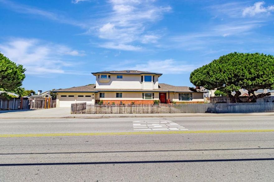 Discover this rare coastal retreata stunning 2,562 sq ft home on an expansive 21,384 sq ft lot just walking distance to the ocean. Featuring 3 bedrooms and 2.5 baths, the home blends comfort and functionality with upstairs heated floors, an updated open-concept kitchen, full bar area, and a separate downstairs kitchenette. The layout includes two downstairs bedrooms, an indoor laundry room, and seamless flow for everyday living or entertaining.  Outdoors, enjoy sweeping mountain and ocean views from expansive decks, relax in the spa, or take advantage of the abundance of flat, open space. A detached 800+ sq ft workshop offers endless potential for trade work, oversized vehicle storage, or creative pursuits. For hobbyists and watercraft enthusiasts, the attached 5-car garage provides unmatched versatility. This is more than a homeits a lifestyle, offering coastal living with space to create, relax, and play.
