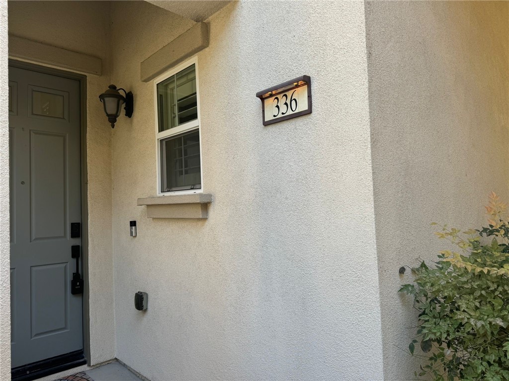 This beautiful unit in the desirable Riverbend Community is a large model with a multi-level open floor plan, plenty of windows, high vaulted ceilings and a modern feel! A converted downstairs bedroom room with attached full bathroom, lots of natural light, chandelier, whitewashed reclaimed wood accent wall. Formal dining room with a chandelier, custom shelves and reclaimed wood accent wall. Spacious kitchen with custom brick accents, granite counters, recessed lighting, stainless steel appliances, newer dishwasher, cabinets galore and breakfast bar. The adjoining family room has lots of windows, gas fireplace and reclaimed wood accent wall. Half bath with pedestal sink, custom light and mirror and half paneled wall. Additional features include window shutters, ceiling fans, stained concrete and newer Optimax Performance Monterey Bay Hybrid Resilient Flooring. Three bedrooms are upstairs along with hall bath and laundry room. Primary suite has newly renovated soaking tub and shower, dual sinks, walk-in closet and side closet. Backyard has artificial grass and room for BBQ and seating area. Attached garage with extra storage. Interior location close to the pool/spa and within walking distance to Steve Ambriz Memorial Park! HOA amenities include community pool/spa and WIFI! Make this your new home!