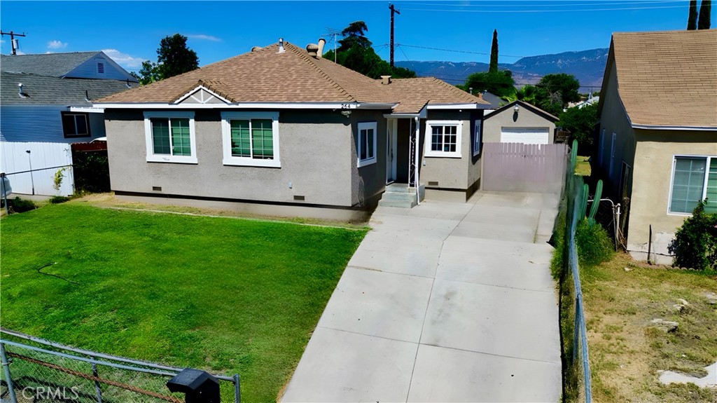 Discover this fabulous 3-bedroom, 1-bathroom upgraded home, just minutes from the 210 freeway, offering convenient access to downtown San Bernardino and major commuter routes. As you approach, the curb appeal captivates with a freshly manicured lawn and a charming front walkway. Situated on a generous 6,550-square-foot lot, this property boasts the potential for expansion imagine adding to the existing square footage or building an ADU/JrADU to suit your vision. The detached one-car garage awaits at the end of the driveway, with ample parking space for family gatherings or weekend barbecues with friends. Step inside to find a home where the heavy lifting has already been done! Newer upgrades include a AC system, energy-efficient dual-pane windows, a remodeled bathroom, new landscape irrigation for the lush green grass, new flooring and doors throughout, fresh interior and exterior paint, and updated light fixtures that add a touch of elegance. Whether you're a first-time buyer or looking to downsize, this low-maintenance charmer is perfectly positioned near many of the city’s amenities . Don’t miss your chance to own a move-in-ready home!