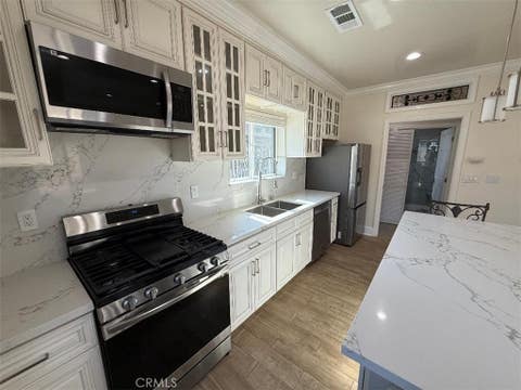 Photo of 3843 Weston Pl Pl #A, Long Beach, CA 90807 (MLS # PW26177105)