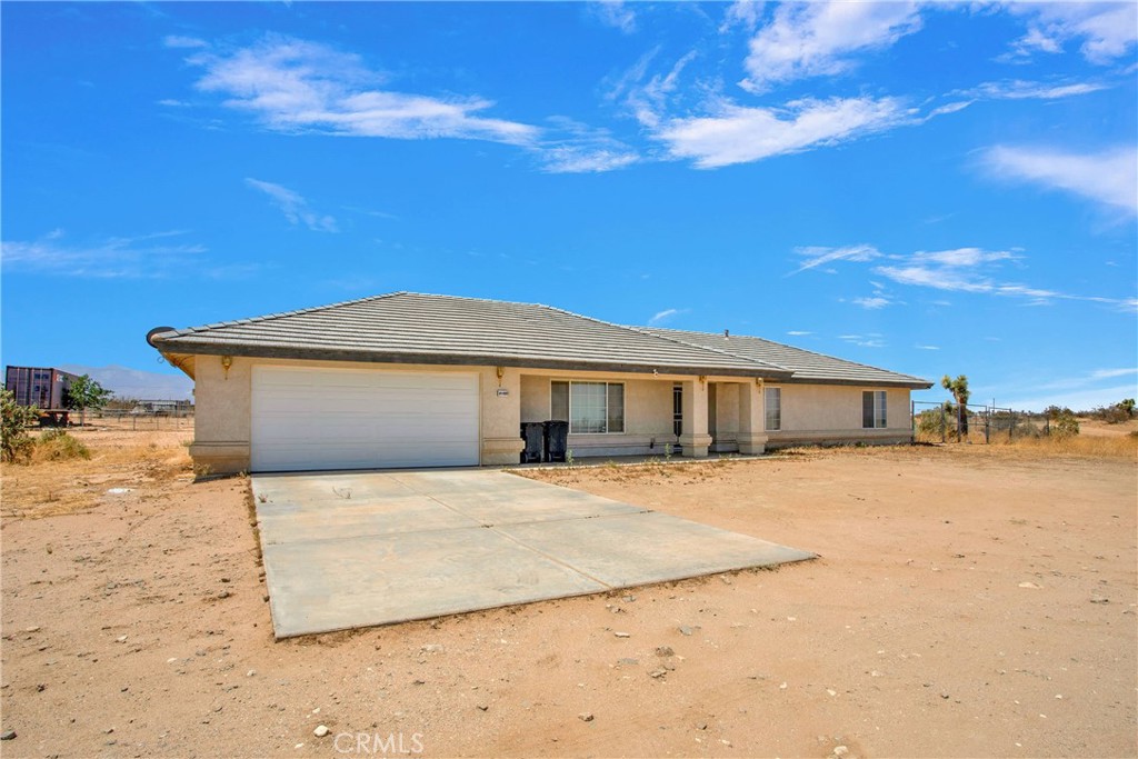 This charming single-story home sits on a spacious 1.8-acre lot, offering plenty of room to breathe and enjoy the wide-open desert landscape. Featuring 4 bedrooms and 2 bathrooms, this home is perfect for anyone seeking space and tranquility.
Step inside to a warm and inviting living area highlighted by a classic brick fireplace, ideal for cozy nights in. The kitchen boasts abundant cabinetry, upgraded countertops, and ample workspace—perfect for cooking and entertaining. A dedicated indoor laundry room adds everyday convenience.
Enjoy the outdoors year-round with a covered patio, ideal for relaxing or hosting gatherings. The low-maintenance desert landscaping complements the natural surroundings while keeping upkeep minimal.
Whether you're looking for room to grow, space for your hobbies, or a quiet place to call home, this property combines rural charm with practical living.