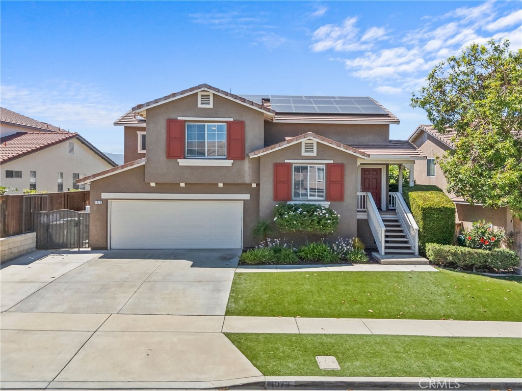 GORGEOUS POOL HOME WITH PAID-OFF SOLAR AND A REMODELED KITCHEN IN SOUTH CORONA! Welcome to this beautifully upgraded 3 bedroom, 2.5 bathroom home with a flexible layout and stunning mountain views. As you enter, you’ll find a custom-built office area, perfect for working from home or managing daily tasks. This popular split-level floor plan offers a spacious and functional design. Upstairs, you’ll find the fully remodeled kitchen a true showstopper featuring white soft-close cabinets and drawers, a custom island with bar seating, and a built-in custom bar area with a beverage fridge. The kitchen opens to the family room and leads out to a covered balcony with breathtaking mountain views, ideal for enjoying your morning coffee or evening sunsets. Also, upstairs is the serene primary suite, complete with a fully renovated en-suite bathroom with spa-like finishes and a walk-in closet. Downstairs, you’ll find two additional bedrooms, a full bathroom, a laundry room, and a second living area currently used as a game room, with sliding doors that open to the resort-style backyard. This entertainer’s dream yard features a gorgeous custom-built pool and spa, artificial turf, and low-maintenance hardscape. Additional upgrades include tile flooring in the kitchen and living room, whole-house fan, newer water heater, and an A/C unit replaced within the past 10 years. The home also includes paid-off solar with 45 panels, helping you save on energy costs year-round. The three-car tandem garage offers great flexibility. The tandem portion is currently being used as additional living space but can easily be converted back into full garage use. The garage also features a 240V EV charger hook-up and provides access to a spacious under-home storage area offering plenty of room for seasonal items, tools, or additional storage needs. With LOW HOA dues, LOW TAXES, and a prime location near top-rated schools, shopping, dining, and convenient access to the 15 and 91 freeways, this home truly has it all modern upgrades, energy efficiency, and an unbeatable South Corona location.