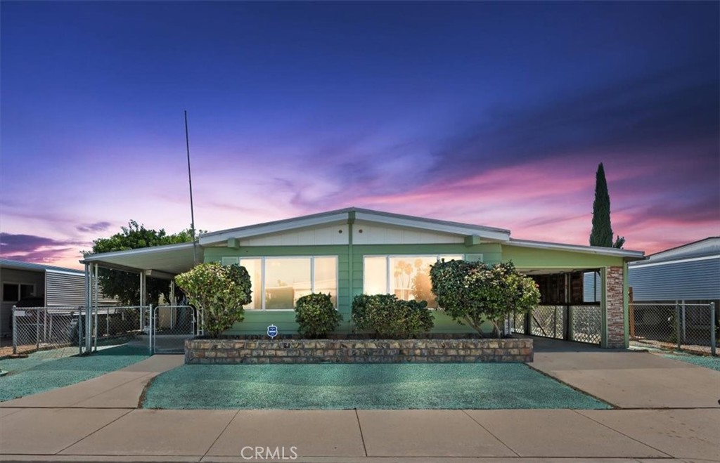 Welcome to Sierra Dawn Estates, one of Hemet’s most vibrant 55+ communities! This spacious 2-bedroom, 2-bath home offers a bright, open floor plan with plenty of room for entertaining. The living and dining areas flow seamlessly, with the dining room featuring a built-in hutch and the family room located just off the kitchen. The kitchen is well-appointed with Corian counters, breakfast bar, deep sink, laminate flooring, and abundant cabinetry for storage. Updates include dual-pane windows and newer carpet. Both bedrooms are generously sized—the oversized guest room offers ample closet space, while the primary suite includes a huge bathroom with dual sinks, walk-in shower, and abundant storage. Additional highlights include an indoor laundry room with cabinetry, a fenced patio for privacy, and a versatile side bonus room ideal for storage, hobbies, or a workshop.
As a resident of Sierra Dawn Estates, you’ll enjoy fantastic amenities designed to enrich your lifestyle—four sparkling swimming pools, multiple clubhouses, a fitness center, shuffleboard, card games, crafts, a library, social events, and day trips. With low association dues, you get all the benefits of an active and welcoming community at an affordable cost.
Don’t miss your chance to experience the comfort of this home and the unbeatable amenities Sierra Dawn Estates has to offer!