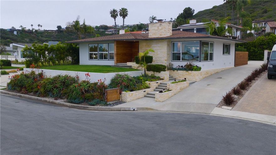 Price reduced $151,000! Seller is motivated. Tucked away on a peaceful cul-de-sac in Southeast San Clemente, this beautifully redesigned single-level home captures sweeping ocean and island views, offering a rare blend of tranquility, style, and location. Completely reimagined by Eyoh Design in 2015, the home reflects a refined coastal aesthetic inspired by mid-century modern architecture and organic materials.



From the moment you arrive, the thoughtful design is evident—clear cedar siding, Ipe wood accents, limestone details, and textured concrete create a warm, modern exterior. A custom pivot entry door opens into an expansive great room where floor-to-ceiling picture windows frame endless ocean views. A sleek mid-century style fireplace, built-ins, and seamless indoor-outdoor flow set the tone for sophisticated beachside living.



The open-concept kitchen features shaker-style cabinetry with a beachy twist, a custom Walnut waterfall bar, stainless steel appliances, and a pass-through window that connects directly to the outdoor concrete bar—perfect for entertaining.



The outdoor spaces are just as impressive. A private rear courtyard features Ipe decking, built-in seating, and lush landscaping that feels like a secluded retreat. Two bedrooms with ocean views share a stylish full bath, while a separate powder room accommodates guests.



The standout feature is the luxurious primary suite, added during the 2015 renovation. Vaulted ceilings, a dual-sided limestone fireplace, and a spa-inspired soaking tub create a serene atmosphere. Other highlights include a cosmic granite seating area, dropdown projector and screen, custom Walnut cabinetry, Western 8’ bi-fold doors, and an expansive ensuite bathroom with dual vanities, a walk-in shower, and a skylit walk-in closet. Direct access to the sunken spa and outdoor shower completes the resort-like feel.



Additional features include a walk-in pantry, interior laundry, upgraded electrical and plumbing, surround sound, and custom window treatments throughout. The oversized two-car garage, long private driveway, and multiple grassy areas—ideal for play or relaxing. The flat driveway even doubles as a basketball or pickleball court.



Situated near San Clemente’s 2.5-mile beach trail, renowned surf breaks, the pier, and the vibrant downtown with new restaurants and shops, this property is a true coastal sanctuary. Opportunities to own a home of this quality are few and far between. NO MELLO ROOS or HOA