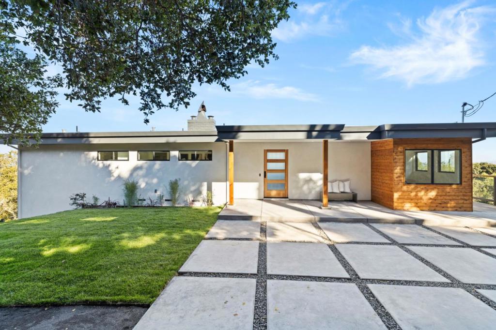 Stunning, fully remodeled modern home nestled on .8 acres in the heart of Palomar Park, offering majestic views from every space. This masterpiece boasts 4 spacious bedrooms & 3.5 luxurious baths, with primary suites on each floor. Each well-appointed bedroom opens onto a walk-out deck, where you can soak in the panoramic vistas of the surrounding beauty. The open-concept kitchen is a chefs dream, featuring a large island & top-of-the-line appliances including wine fridge, gas range & microwave drawer. An oversized sliding glass door on the upper level seamlessly connects the open-concept living space to the expansive deck, which runs the length of the home- perfect for entertaining & taking in the stunning surroundings. Custom touches, like the charming homework nook in the kitchen, a built-in planter above the fireplace & a Park City ski lift swing repurposed as seating on the deck, are sure to delight. Additional features include a dedicated laundry area with new washer/dryer, A/C, 2-car garage, owned solar & a private, peaceful setting adjacent to Eaton Park, with access to scenic trails. This Palomar Park treasure offers a harmonious blend of luxury, comfort & nature, perfect for those seeking both privacy & proximity to outdoor adventures, with a strong sense of community.