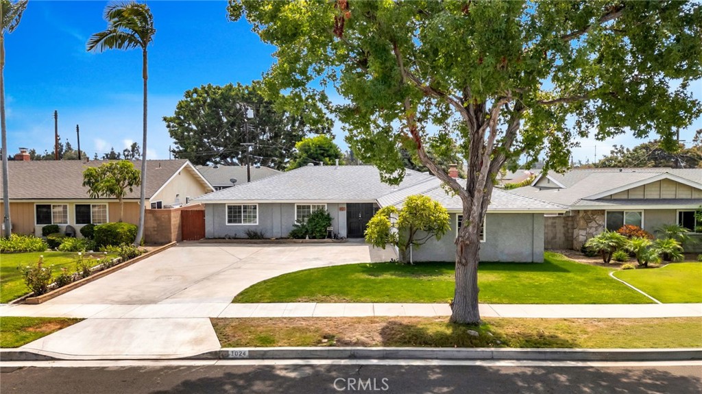 Welcome to Cambridge Estates. 1024 Tularosa, a 4-bedroom 2-bath with a pool, just 3 minutes from Old Towne or the 55 or 22 freeways! Great location! An extra-wide driveway leads to a detached 2-car garage. Gated entry through the double door leads into an open floor plan featuring a large living room, family room with brick fireplace, and an eating area. The entry has terrazzo stone floors, new life-proof vinyl wood textured floors, and new carpet in the bedrooms. The kitchen has quartz counters, Euro white cabinets with accent display doors, stainless steel appliances, including a dishwasher, a 5-burner built-in gas range with commercial-grade hood, and a full-size electric double oven, perfect for those holiday meals. separate laundry room. There are 4 bedrooms, mirrored wardrobe doors, ceiling fans, and 2" mini blinds that accent the rooms. The primary bedroom has its own bath with a neo-angle tile shower. The main bath has a tub/shower accented in tile. Central heating and air keep you comfortable all year long, and the best part is having a pool to have fun and a fire pit to dry off. A large patio area to enjoy with the summer BBQ. *Professional pictures coming soon*