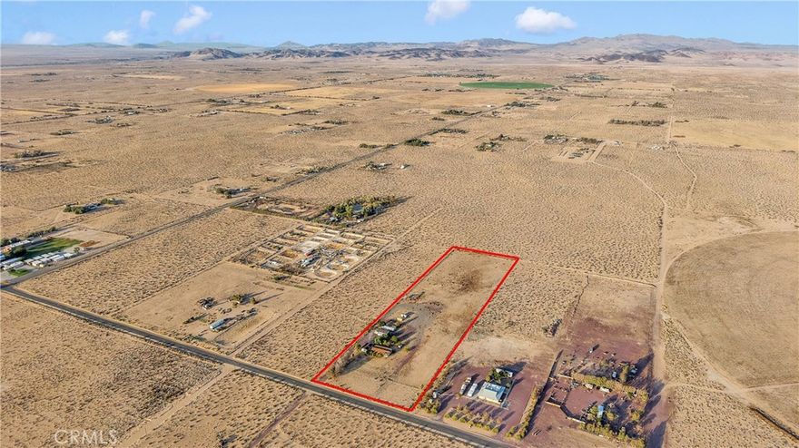 Welcome to this 1,625sq ft manufactured home nestled on a sprawling 9.5-acre parcel, featuring 3 bedrooms and 2 full bathrooms. Built in 1986, this desert retreat blends functional rural living with spacious comfort 

Interior Highlights: Three generous bedrooms & two full bathrooms;Cozy warmth from two wood-pallet-burning stoves and central heating;Practical kitchen with pantry, laundry room, and plenty of storage space;Open living spaces ideal for family gatherings or quiet evenings

Exterior & Land Features: Expansive 9.5-acre lot zoned for agricultural use—perfect for horses, livestock, or hobby farming; 1,000?sq?ft garage with leased solar panels—great for a workshop, tools, or vehicles;Permitted outbuildings connected to utilities—ideal as guest quarters, rental units, or caretaker’s home (may require updates/permitting);Covered parking with RV/workspace potential, paved main-road frontage, and fenced surroundings

Utilities & Amenities:Well water and septic