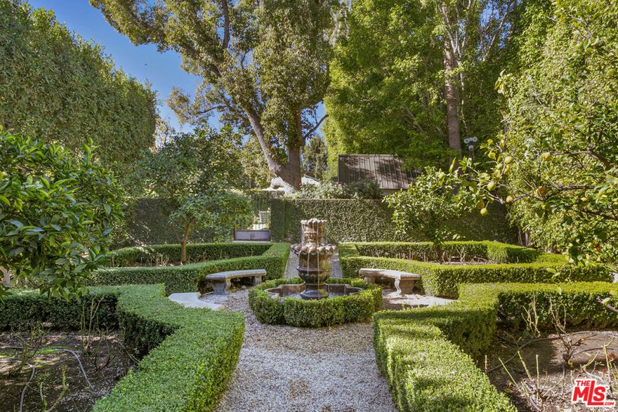 JUST REDUCED! One of the most spectacular properties ever offered in Hancock Park. Supreme estate compound w/multiple structures including a grand residence on 3 levels. Flat, sprawling corner lot w/2 parcels totaling over 1 acre. Designed in 1923 by famed architect Elmer Grey, the home underwent a major renovation/addition supervised by architect/builder Bill Baldwin w/luxurious interiors completed by eminent White House designer Michael Smith. Published in ARCHITECTURAL DIGEST, the home features numerous custom details including hardwood, crown molding, designer lighting, Venetian plaster, French doors, blown glass skylights & 8 fireplaces, all creating a stunning backdrop for large scale entertaining & comfortable living. Foyer w/marble & chandelier. Living room w/tray ceiling. Formal dining. Eat-in chefs kitchen w/state of the art appliances. Butlers pantry & bonus catering kitchen. Family room. Library. Remarkable 2-story gallery/salon w/wrought iron & music mezzanine. 6 ensuite bedrooms up. Primary w/sitting, opal white stone bath & walk-in dressing. Lower level w/theater, snack bar, playroom & storage. Guest house w/bath & hair salon. Huge motor court & 3-car garage. Enormous backyard w/patio, 2 grassy yards, pool, cabana, paddle tennis, herb & hedged secret garden. Walled & gated for privacy. Truly no expense spared. Many more details. Worthy of every superlative!