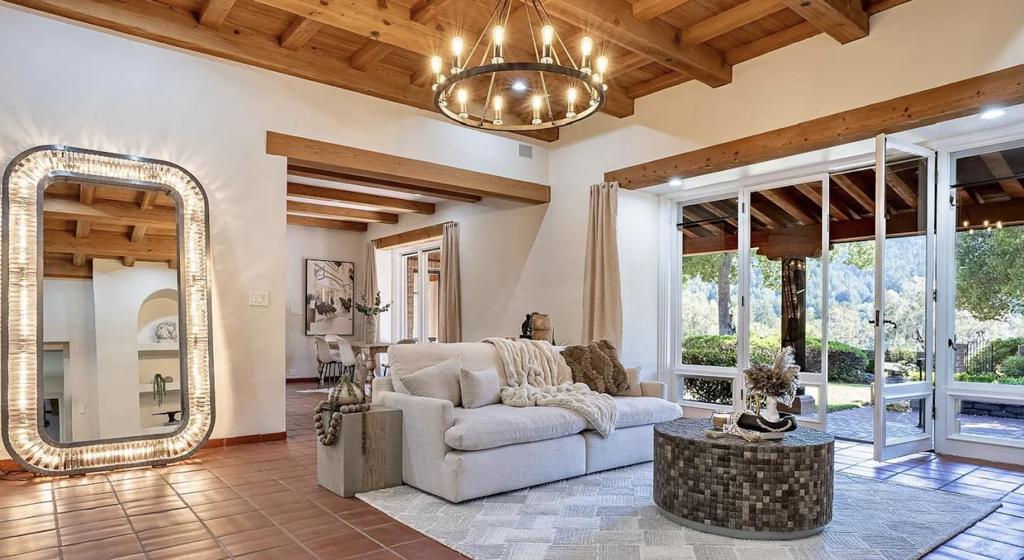 Sophistication Meets Serenity. Nestled at the end of a cul-de-sac off the coveted Mountain-Home Road, this exceptional estate sits atop the ridgeline, offering breathtaking, ever-changing vistas of the lush mountainsa view unmatched in all of Woodside. Secluded amidst the natural rolling landscape of majestic Sequoias and Oaks, this property is one of the few that boasts its own vineyard, producing exclusive Chardonnay for the renowned La Honda Winery. Spanning 3.3 acres, this timeless Spanish-villa-style residence embodies the elegance of Woodside living. The home features three spacious bedrooms, with an additional study that can serve as a fourth bedroom option, 3.5 beautifully remodeled bathrooms, and a gourmet chefs kitchen with a large center island. Each bedroom suite provides private access to a serene outdoor area, leading to a large pool with a jacuzzi and a detached 3-car garage. The meticulously landscaped grounds enhance the estates allure, including a pathway to a newly renovated office or guest house complete with a full bathroom, kitchenette, and a viewing deck. This property is an embodiment of refined living while strategically placing you in the heart of Silicon Valleys thriving business ecosystem, with easy access to Highway 280, Stanford University, and SFO.
