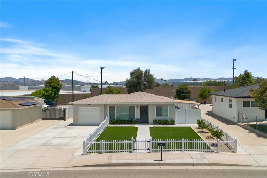 FULLY REMODELED AND LOOKS LIKE A NEW CONSTRUCTION HOME! This commuter-friendly home sits on a HUGE 9,148 sq.ft. lot that allows for vehicle access into the backyard. It features 3 bedrooms & 2 baths all on a single level. The new kitchen features white shaker cabinets with soft-close doors/drawers, quartz countertops, single-basin stainless steel sink, new GE appliances: modern stove, microwave & dishwasher. Both bathrooms have new showers, new vanities, quality Moen fixtures and Kohler toilets. Low maintenance luxury vinyl plank flooring throughout, new baseboards and doors. Newer energy efficient Central Heating & A/C, water heater, roof, plumbing, sewer line, electrical panel & LED LIGHTING THROUGHOUT. Inside laundry hook-ups. Backyard has TWO covered patios, variety of fruit trees and ample room for RV parking, work trucks, etc. Lots of room for entertaining. The front yard is gated and has low maintenance artificial turf with citrus trees. Limited landscaping service is included in the rent. A house in this condition will go very fast. Landlord looking for tenants with FICO's ideally above 620, income that is at least 2.5 times the rent, no evictions. Pets will be considered upon submittal. Ready for immediate move-in.