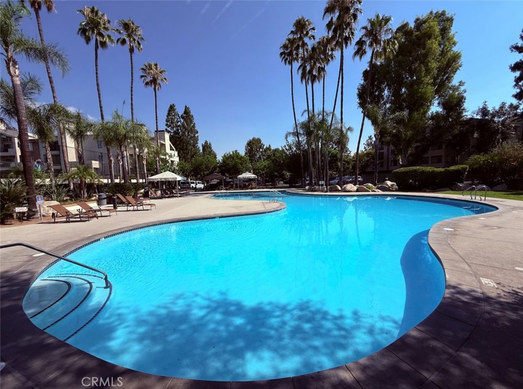 Welcome to this 2-bedroom, 2-bathroom condo in Woodland Hills / Warner Center. Enjoy central A/C, a private balcony, fireplace in the living room, and a spacious master bedroom with ample closet space and dual sinks. The kitchen boasts granite countertops, complemented by fresh paint and newer flooring throughout. The gated community, with 24-hour security, features 4 pools and spas, 6 lighted tennis courts, and a well equipped gym. Includes underground parking and abundant visitor spaces. Steps away from Concerts in the Park, the Rams training facility, and premier shopping and dining just South on Ventura Blvd.