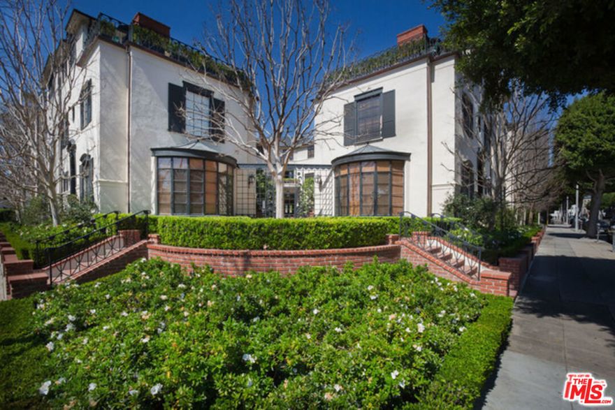 Stunning two-story townhouse. Designer unit in impeccably restored 1930's traditional old Hollywood building located in the heart of Beverly Hills on Rodeo Drive. Highly sought after location close to Beverly Wilshire Hotel, shops, and fine dining. Classic finishes include hardwood floors, custom crown molding, recessed lighting, stainless steel Viking appliances, marble countertops, Miele Washer/Dryer in unit. fireplace and central heat and air condition. Large walk-in closets and spacious spa-like bathrooms.  Laundry inside unit.  The unit comes with a tandem subterranean parking space in gated secure garage.**Units slightly vary in floorplan.