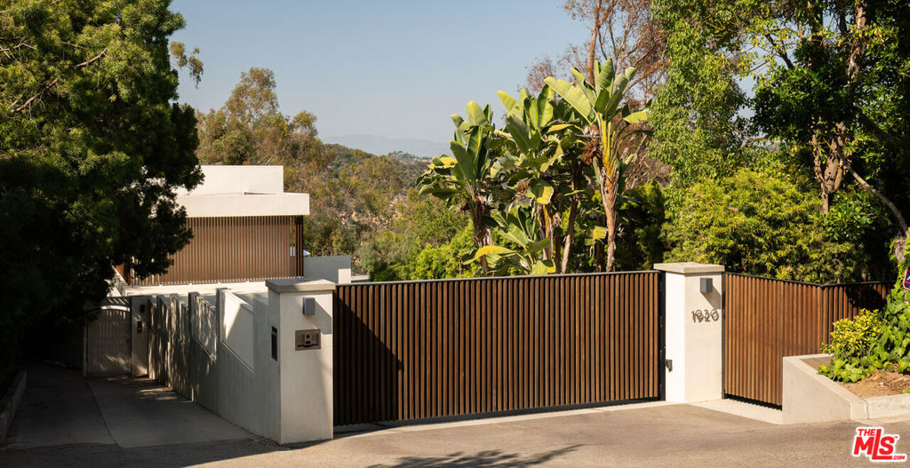 Private and exclusive Modern Organic Bel-Air Retreat, with elegant design and stunning views. Discover the epitome of luxury living in this exceptional 5-bedroom, 6-bathroom resort like estate, located in the prestigious enclave of Bel-Air. Fully gated and sitting on its own 2 acre plus promontory, spanning an impressive 5,842 square feet across 2 thoughtfully designed levels, this rare offering combines luxurious comfort with natural beauty. Nestled in a serene setting, the home boasts sweeping views of the tranquil Stone Canyon reservoir also known as the Lake Como of Los Angeles, the city skyline and the glistening Pacific Ocean. Every detail has been meticulously curated to reflect warmth and sophistication, blending contemporary aesthetics with organic textures and finishes and inclusion of nature's most beautiful elements. Bright, open-concept interiors flooded with natural light, through walls of glass offering a seamless indoor-outdoor flow. Gourmet kitchen perfect for entertaining featuring state-of-the-art appliances and stylish finishes. Luxurious Bedrooms & Spa-Like bathrooms, large closet spaces. Ample outdoor spaces with beautifully landscaped grounds and access to hiking trail around the reservoir with a multitude of entertaining areas, and high-end amenities like pool, spa and gym. With breath taking sunsets, utmost privacy, recess back to this rare oasis from the city, and enjoy the California lifestyle at its best. Available for short- and long-term stays.