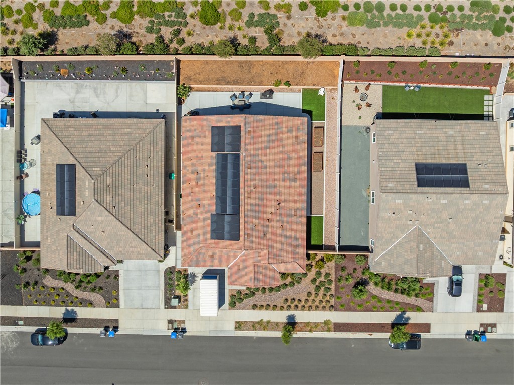 ***PAID OFF SOLAR*** Stunning single-story home in Menifee’s prestigious Legacy at Braverde community. Sitting on a beautifully landscaped quarter-acre lot, this 2,615 sq. ft. home combines high-end finishes, modern design, and thoughtful details throughout. Wide hallways and impressive 8-foot, 6-panel doors create an open, airy feel from the moment you walk in. The gourmet kitchen is the heart of the home, overlooking the dining and family rooms, and features a GE stainless steel appliance package, oversized pantry, maple cabinetry, and LED lighting. The master suite feels like a private retreat with its upgraded oversized walk-in shower and large walk-in closet. Two additional spacious bedrooms and 2.5 well-appointed bathrooms provide comfort for family and guests. Step outside to an entertainer’s dream backyard with a low-maintenance landscape, perfect for enjoying Menifee’s sunny days. Energy efficiency is built-in with a fully paid-off solar system for minimal utility costs. Living here means you’re just minutes from Menifee Countryside Marketplace and Shops at Newport, offering dining, shopping, and entertainment options. Outdoor enthusiasts will love being close to Heritage Lake Park, DropZone Waterpark, and the scenic trails at Lake Perris State Recreation Area. For weekend wine-tasting, Temecula Wine Country is less than 25 minutes away. Easy freeway access puts Murrieta, Temecula, and surrounding areas within quick reach. This home offers the perfect combination of style, comfort, and location—ready for you to move in and start enjoying the Menifee lifestyle!