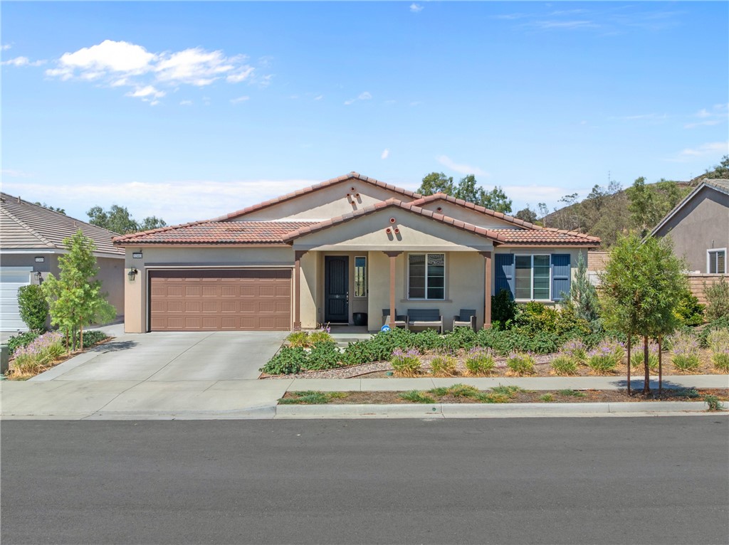 ***PAID OFF SOLAR*** Stunning single-story home in Menifee’s prestigious Legacy at Braverde community. Sitting on a beautifully landscaped quarter-acre lot, this 2,615 sq. ft. home combines high-end finishes, modern design, and thoughtful details throughout. Wide hallways and impressive 8-foot, 6-panel doors create an open, airy feel from the moment you walk in. The gourmet kitchen is the heart of the home, overlooking the dining and family rooms, and features a GE stainless steel appliance package, oversized pantry, maple cabinetry, and LED lighting. The master suite feels like a private retreat with its upgraded oversized walk-in shower and large walk-in closet. Two additional spacious bedrooms and 2.5 well-appointed bathrooms provide comfort for family and guests. Step outside to an entertainer’s dream backyard with a low-maintenance landscape, perfect for enjoying Menifee’s sunny days. Energy efficiency is built-in with a fully paid-off solar system for minimal utility costs. Living here means you’re just minutes from Menifee Countryside Marketplace and Shops at Newport, offering dining, shopping, and entertainment options. Outdoor enthusiasts will love being close to Heritage Lake Park, DropZone Waterpark, and the scenic trails at Lake Perris State Recreation Area. For weekend wine-tasting, Temecula Wine Country is less than 25 minutes away. Easy freeway access puts Murrieta, Temecula, and surrounding areas within quick reach. This home offers the perfect combination of style, comfort, and location—ready for you to move in and start enjoying the Menifee lifestyle!