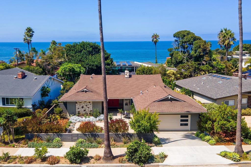Mid-century modern single-story gem in the heart of Ocean Beach’s Sunset Cliffs, just one block from the water. This four-bedroom, two-and-a-half bath home captures ocean views from the living room, primary suite, and backyard. Filled with natural sunlight and tucked into a quiet residential neighborhood, the home offers flexible space—perfect for creating a home office and working remotely in comfort. Designed for easy indoor-outdoor living and entertaining, the property features fully landscaped front and back yards with fig, passion fruit, and peach-plum trees. While this wonderful home offers timeless mid-century style, it’s ready for a new owner to add their personal touch. Paid Solar and EV charger a plus. A rare single-level opportunity in a coveted coastal neighborhood.