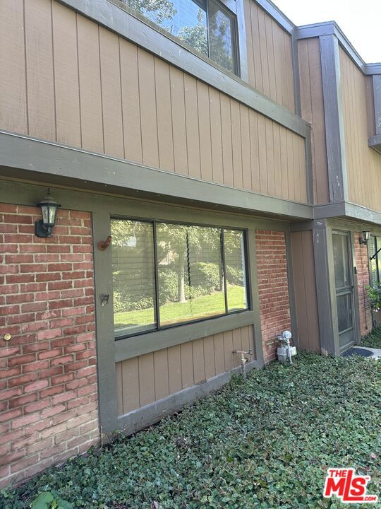 Turn-key townhome in a gated community with manicured landscaping, a sparkling pool, and spa, plus ample guest parking. This freshly painted 3-bedroom, 2.5-bath home features new carpet, updated fixtures, and brand-new appliances. The open floor plan includes a spacious living room with fireplace and a modern kitchen with quartz countertops and garden window overlooking the large enclosed patio. A private double garage provides direct access. Stove, refrigerator, washer, and dryer are included without warranty. Truly move-in ready!
