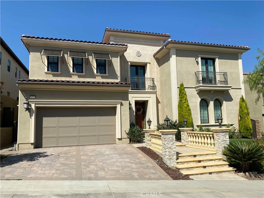 Spectacular executive property in prestigious, gated Westcliffe at the summit of Porter Ranch! This Seeley Model with Italianate facade has 4 beds, 4 1/4 baths in 5492 square feet, 3-car garage, pool, spa, and water feature with three cascading waterfalls, and mature front/rear yard landscaping accented by professional lighting. The approach to the impressive entry door along travertine-stone covered steps, flanked by concrete balusters and rails, hints at the elegance inside. Upon entering, the perspective is stunning--dual floating circular staircases adorned with wrought iron balusters and railing, with a 7-foot tall wrought iron & crystal chandelier topped by a custom medallion, take your breath away. Equally impressive is the view beyond the floating stairs through the living area to the rear, encompassing the 3-panel stacking sliders and California room/patio with the pool, water feature, and unique landscaping prominently featured. The kitchen has full-height cabinetry (10 ft ceilings), with a massive, nearly 12-feet long granite island, and is equipped with Kitchen Aid appliances including dual ovens, six-burner gas grill with griddle, microwave, and trash compactor, along with a Sub-Zero refrigerator customized with wood panels matching the cabinetry. The entire kitchen nook back wall is accented by stacked stone matching the stone inset between the lower and upper cabinets. There is also a large walk-in pantry and granite-topped prep/bar area. Adjacent to the kitchen is a huge greatroom, complete with a custom 42-inch linear fireplace (gas) and concrete mantel encased by floor-to-ceiling travertine stacked stone. There is also a spacious bedroom with large walk-in closet on the first floor, along with a separate office/study adjacent to the greatroom. Upstairs, the master bedroom suite is its own separate west wing, complete with a massive retreat/escape/balcony adjoining the master bedroom. There are not one but two large walk-in closets as well as a linen closet. The master bath has dual vanities with custom marble tops, a large bath with marble top, and a truly massive walk-in shower with marble seating. The upstairs east wing has a very large bonus room (could be the 5th bedroom), two more bedrooms, and laundry room. All bedrooms have en suite bathrooms. There is crown molding & recessed lights throughout, as well as ceiling fans in all bedrooms and the greatroom. The alarm system is builder-installed/hardwired. Listed at $2,575,000.