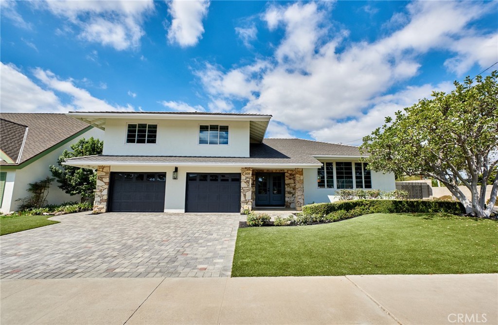 This beautifully remodeled home offers a bright open-concept floor plan with wide-plank engineered hardwood floors, custom built-ins, and a sleek modern fireplace. The chef’s kitchen features an oversized island with bar seating, designer lighting, and custom wood cabinetry—perfect for entertaining or everyday living. Separate family room for watching the big games and entertaining in multiple areas. Step outside to a private backyard retreat complete with a custom BBQ, covered patio, and stylish seating area—ideal for dining al fresco or relaxing with friends. Paid off solar panels included.With its seamless indoor-outdoor flow, this home captures the best of California living. Located just minutes from Old Towne Orange, top-rated schools, shopping, dining, and convenient freeway access, this home combines modern design with an unbeatable location.