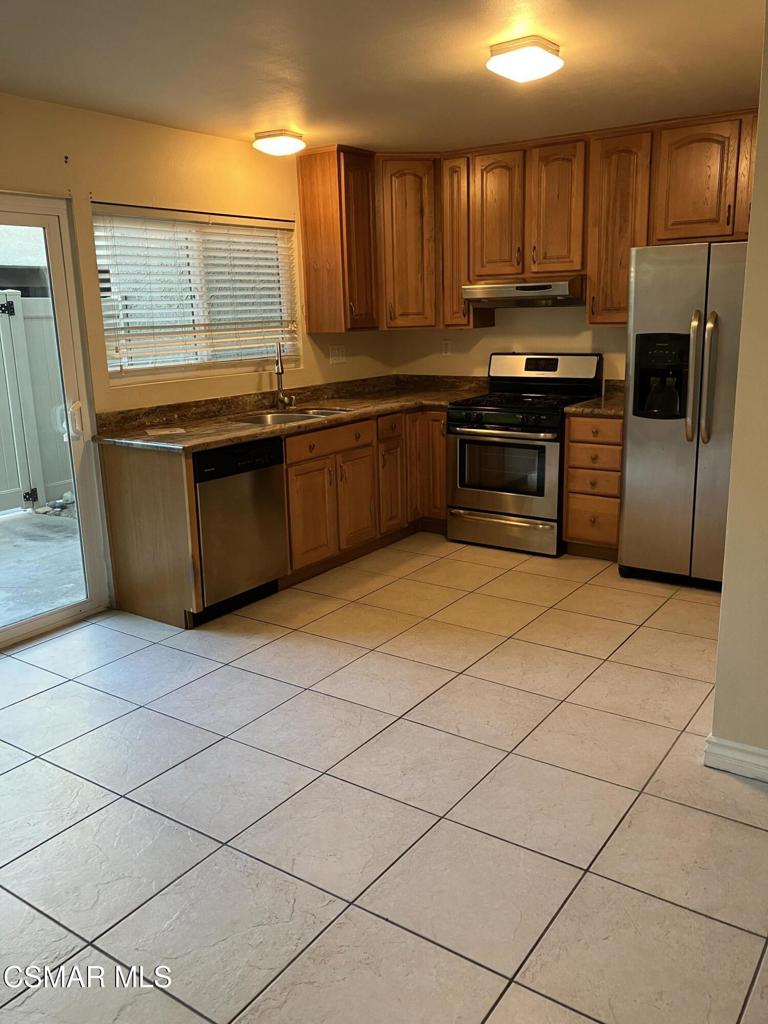 Great time to become a home owner This home is near Awarded Wildwood Elementary School. 3 Bedrooms and one full Bathroom up stairs with a half bath room downstairs. Kitchen comes with Stainless Steel Appliances. Refrigerator is included .Built in Microwave with Range and Oven. Eat in Kitchen . Granite Counter tops. Lots on Cabinets for all your cooking needs. Next to Kitchen is the Laundry Room r Washer and Dryer are included. There is a Half Bath next to Living RoomLiving Room has gas Fireplace with Gas Logs. UP stairs are the 3 Bedrooms. Master Bedroom has Walk in Closet plus a double closet . Bathroom has Big Tub with Shower. Wood like floors throughout , Patio off Kitchen with Vinyl Fence. Great for BBQ. Next to your gate is your second parking area. You also have a covered carport steps away.HOA Pays for trash and Earthquake insurance. Gated Pool Area. Wildwood park is close by.