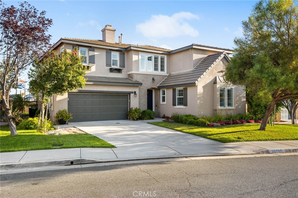 Welcome to this stunning 5-bedroom, 3.5-bath home nestled at the end of a quiet cul-de-sac in the desirable Hartford Park community of Wildomar. Built in 2008 and offering 3,266 sq ft of elegant living space, this home seamlessly blends modern luxury with thoughtful design.
Step inside to a grand entry adorned with beautiful white porcelain tile that flows throughout the main level. You'll immediately notice the abundance of natural light streaming through large windows, complemented by plantation shutters, crown molding, chair rail accents, and 5" baseboards that add a sophisticated touch.
Ideal for multigenerational living, this home features two bedrooms downstairs—one a private ensuite perfect for guests or extended family. The second downstairs bedroom, situated near the entry, showcases three expansive picture windows overlooking the formal living room, making it an excellent option for a home office.
The heart of the home is the spacious, open-concept kitchen, complete with white shaker cabinets, stainless steel appliances, a center island, and generous pantry space. It opens directly to the inviting family room with a cozy gas fireplace, creating a perfect spot for gatherings.
Upstairs, durable laminate wood plank flooring continues through a versatile loft and into the additional bedrooms. Two bedrooms share a stylish jack and jill bath with double sinks, a large tub and shower, and a separate water closet. Just off this area, you'll find a built-in desk nook and a conveniently located upstairs laundry room. The expansive primary suite offers a luxurious retreat with separate vanities, a soaking tub, a walk-in shower, and an extra-large walk-in closet.
Enjoy elevated features throughout, including high ceilings and recessed lighting elegantly tucked behind crown molding in the formal living area, loft, and above the stairs.
Step outside to a spacious backyard with a grassy area, patio space, and a combination of block and vinyl fencing—plus no rear neighbors for added privacy.
Additional highlights include dual AC units, no Mello Roos, a low tax rate, and a fantastic location close to the freeway, schools, shopping, parks, and just minutes to Temecula Wine Country. Seller is generously offering $10,000 toward buyer’s closing costs or to help buy down your interest rate.
This gorgeous, turnkey home is the perfect blend of comfort, style, and modern living—come see it today and make it yours!