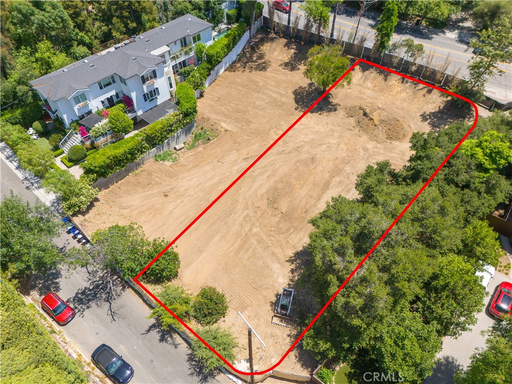 Build your dream home today – a rare, shovel-ready lot with approved plans for a 6,333 sq ft modern farmhouse in the quiet, celebrity-studded Studio City Hills. This sprawling 14,358 sq ft lot, plus an adjacent paper street parcel of 7,200 sq ft for up to 21,558 sq ft of usable space, is located on a picturesque, tree-lined street just across from Fryman Canyon and within the top-rated Carpenter School District. All city clearances done – no haul route, no caissons, gentle 5% slope. Save years of notorious permitting delays – just pull the permit and build. The included plans feature a thoughtfully designed open-concept floor plan with a spacious lower level basement and spaces designed for effortless entertaining. Don’t miss this opportunity to build your dream home in one of LA’s most desirable neighborhoods. Seller financing is available.