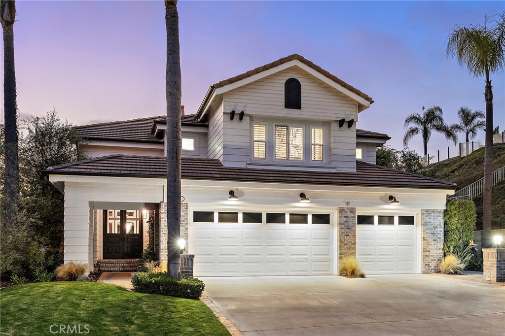 Listed between $2,500,000-$2,700,000!! Tucked inside the gated coastal enclave of Bear Brand Ridge, this beautifully renovated cul-de-sac home blends luxury, comfort, and functionality at every turn. This turnkey residence is ready for you to move right in and enjoy! Thoughtfully upgraded throughout, the home offers a flexible floor plan ideal for modern living and entertaining. The main level features European wood-look tile flooring, elegant five-piece wainscoting, and an open-concept layout that seamlessly connects the bright living and dining areas to the chef’s kitchen. Designed for both style and function, the kitchen offers custom cabinetry, generous storage, a casual breakfast nook, and center island that opens to the inviting family room with a cozy fireplace—perfect for cooler Southern California nights. A spacious first-floor office/bedroom offers flexibility and features custom built-ins and a Murphy bed, making it perfect for guests or work-from-home living. It’s conveniently located next to a fully remodeled bathroom with a Restoration Hardware vanity and marble inlay shower for a sleek, spa-inspired finish. The fully renovated laundry room features ceiling-reaching cabinetry and designer tile. Upstairs, the primary suite opens to a private deck with peaceful sunset views. The ensuite bath includes a stunning marble accent wall, custom vanity, and luxurious Kohler fixtures. Two additional bedrooms and a versatile bonus room with a tongue and groove ceiling complete the upper level. Step outside to your own resort-style backyard. A resurfaced saltwater pool, new hardscaping, lush landscaping, and ambient lighting set the stage for unforgettable evenings. A built-in fire pit creates a cozy gathering space, and a newly installed putting green offers the perfect escape for golf enthusiasts. Additional highlights include a new AC unit, custom closets throughout, and proximity to award-winning schools including St. Anne and St. Edward. Enjoy easy access to world-renowned surf breaks, scenic coastal trails, and abundant outdoor recreation. Just beyond the gates, Ocean Ranch Plaza offers a curated mix of shops, restaurants, and entertainment—all just minutes from your doorstep.