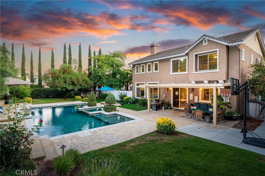 Stunning 4-BEDROOM (with 5th Bedroom Potential), 3.5 BATHROOM home in Temecula’s highly sought-after WOLF CREEK community! Nestled on just over a half acre of a gorgeous forest-like retreat, highlighted by an oversized, breathtaking POOL—with SWIM-UP STOOLS, WATERFALL, built-in SPA, and COVERED PATIO with OUTDOOR FANS, and BBQ area. Perfect for Relaxing or Entertaining. The Front Door Entry welcomes you into an OPEN CONCEPT LIVING ROOM and FORMAL DINING ROOM. The LARGE WINDOWS offer an abundance of NATURAL LIGHT throughout. The GOURMET KITCHEN features a LARGE ISLAND, FARMHOUSE SINK, STAINLESS STEEL APPLIANCES, and WALK-IN PANTRY which flows seamlessly into the spacious family room with soaring ceilings and a cozy fireplace —all with Expansive views of your PRIVATE OUTDOOR PARADISE. The 1st LEVEL is completed by a PRIVATE EN-SUITE Bedroom with Bathroom (currently used as an office), plus a convenient POWDER ROOM for guests and a LAUNDRY ROOM. The 2nd LEVEL offers a versatile, LARGE LOFT AREA which could be used as a PLAY AREA, OFFICE, or (as mentioned) a possible 5th BEDROOM. The OVERSIZED PRIMARY SUITE-RETREAT features a SITTING AREA, luxurious EN-SUITE BATH with SOAKING TUB, Separate SHOWER, DUAL VANITIES, and TWO WALK-IN CLOSETS. In Addition, there are TWO SECONDARY BEDROOMS and a FULL BATHROOM with a DOUBLE VANITY. This amazing home blends COMFORT, STYLE, and PRIVATE OUTDOOR LIVING. Just moments away from TOP-RATED TEMECULA SCHOOLS, PREMIER SHOPPING and DINING, and the famous TEMECULA WINE COUNTRY.