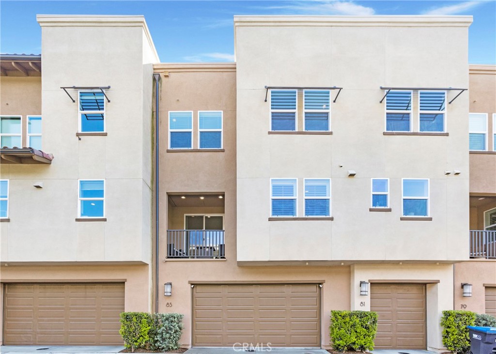 Welcome to 83 Hideaway Loop, in the heart of North Mission Viejo. This stunning tri-level home offers 3 spacious bedrooms, a main-floor den, and 4 bathrooms. The best part of this new home is NO MELLO ROOS! This home combines luxury, comfort, and smart technology in a thoughtfully designed open layout. On the first level you will find a spacious 2 car garage and roomy den, great for an office, playroom, or additional living room. The second level is an entertainer’s dream, featuring a bright, open-concept living space with high ceilings, recessed lighting, and abundant natural light. The chef-inspired kitchen includes a large quartz island, white soft-close cabinetry, stainless steel appliances, and a walk-in pantry. The living area flows seamlessly to a private balcony with a peaceful view. Upstairs, the spacious primary suite offers everything you could possibly want. A walk-in closet, luxurious primary bathroom with a dual vanities, and a walk-in shower with dual shower heads. Two additional bedrooms, a full bathroom, and a conveniently located laundry closet. This smart home is equipped with advanced features including MyHome lighting controls, Kevo, Kwikset smart locks, a Ring camera, Eero Wi-Fi mesh, Honeywell climate control, and MyQ garage system. The attached two-car garage features epoxy floors, an EV charger, and a tankless water heater. The HOA provides resort-style amenities including a large pool and spa, a fire pit, playgrounds, and BBQ dining areas. Ideally located near top-rated schools, shopping, dining, and outdoor destinations like Whiting Ranch and O’Neill Regional Park, this move-in-ready home offers the perfect blend of luxury and convenience.