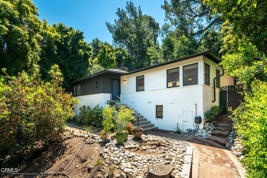 Perched atop a serene setting on Hilldale Drive, not far from the heart of Montrose in the city of La Canada, lies this charming 2-bedroom, 2-bathroom home. The open living and dining areas showcase the updated kitchen and provide access to the den/family room. Additionally, the house features a basement and a slightly terraced backyard. The long driveway accommodates several parked vehicles. Its convenient location offers proximity to shopping, restaurants, a movie theater, and freeway access, making this home a true gem!