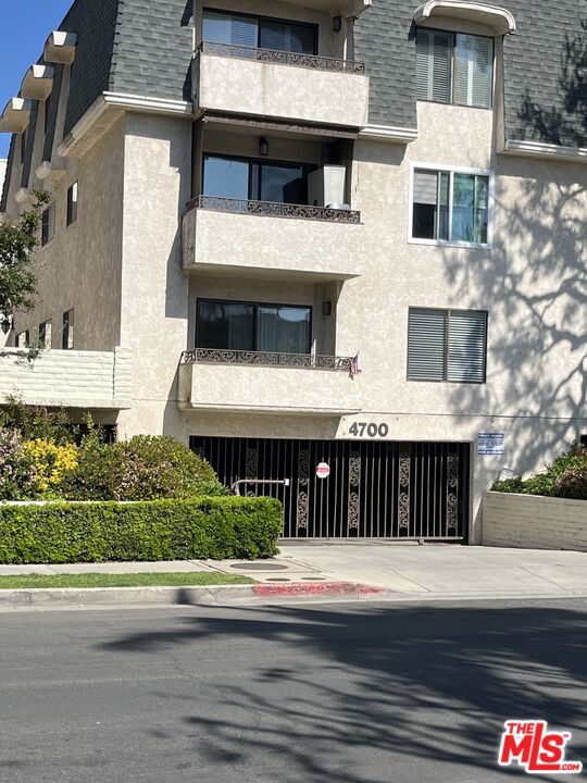 Spacious and bright 2 bedroom and 2 bath, approximately 1,206 square feet condominium located on second floor of a well maintained, elevator served building, walking distance to Ventura Boulevard near all restaurants, super markets, banks and other amenities. The entry opens to a large living room with new wood laminate flooring and lots of natural light, leading to a patio overlooking nicely landscaped yard. The dining area overlooks the quiet, tree lined Natick Avenue. The kitchen has beautiful redwood cabinetry and granite counter-tops, large double door refrigerator, electric stove and oven, microwave and dishwasher. There is a very clean laundry facility on the same floor, near the unit next to the elevator: Bedrooms are of good size with lots of cabinets. Master bedroom overlooks the patio area, and the master bathroom has a new large shower stall. The second bedroom has a bathtub, toilet and sink. In the community parking there are 2 tandem parking spaces and a large additional storage closet. There is a crystal clean pool I'm the community yard. The building is near 405 and 101 Freeways and transportation. Tenant shall pay for own electricity, internet and cable to the condo and must provide rental insurance. Water and sewer charges are covered by the HOA.