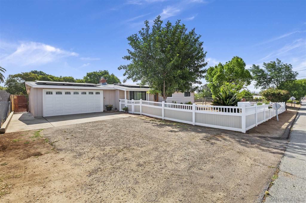 Beautiful custom built home with additional acreage for possible ADU or plenty of parking. This newly remodeled 4 bedroom 2 bath home offers Pine wood open beam ceilings throughout and the living room has a large wood burning fireplace. Throughout the home there is new paint, new vinyl flooring and carpet, crown moulding, new lighting fixtures, new ceiling fans, new water heater and garage sink. The kitchen has oak cabinetry with granite counter tops. The large Family Room offers a free standing fireplace and lots of extra entertaining space. The side/back yard has 2 storage sheds, fruit trees, Pergola and covered motorhome parking with 30 AMP hookup, water and sewer dump. The large side gate to side yard allows for ease of storage or access of property. Solar installed offers low SDG & E bills. Solar Sytem is leased. Near by bus stops allow for ease of transportation. Seasonal Holiday Neighborhood Lights on nearby Lindenwood offer added Family enjoyment. Pepper Drive Elementary offers K-8th grade. Santana High School District to follow 8th grade. Architectural Style: Custom Built View: Custom Built Equipment: Garage Door Opener Sewer: Sewer Connected Topography: LL