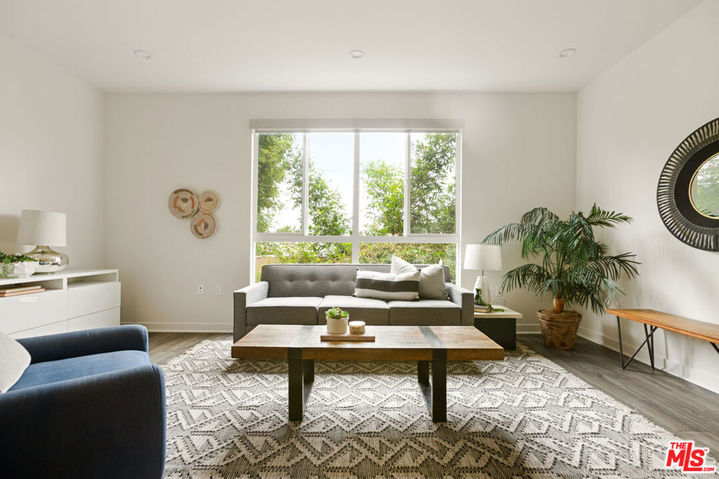 Tucked into the vibrant neighborhood of Van Nuys, this beautifully designed home offers the perfect blend of function and luxury. From the moment you walk in, you'll be impressed by the thoughtful layout and attention to detail throughout. The heart of the home is the spacious kitchen, featuring a large center island ideal for cooking, entertaining, or casual dining. With generous counter space and modern finishes, truly a chef's delight! Retreat to the luxurious primary suite, complete with a spa-like bathroom boasting a walk-in shower, a large soaking tub, and an expansive walk-in closet that offers ample space for your wardrobe and more. Each of the three bedrooms offers comfort and privacy, while all four full bathrooms ensure convenience for family and guests alike. Enjoy quiet mornings or lively gatherings on the patio of your private outdoor space perfect for relaxing or entertaining. A two-car garage provides plenty of storage and protection for your vehicles. Whether you're hosting friends, raising a family, or looking for your forever home, this property has everything you need and more!