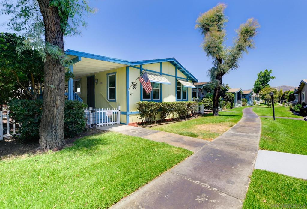 Welcome to one of the most desirable homes in New Frontier, Santee’s premier 55+ gated community! This light, bright, and well-maintained 2BR/2BA home features a newer roof, brand-new water heater, upgraded HVAC system with smart thermostat, and dual-pane windows. The solar system generates 5kWh of power, helping offset electric costs- owners only pay grid access fees. The spacious layout includes vaulted ceilings, multiple living areas, and a kitchen with a 4-burner range and updated appliances. The remodeled primary bathroom adds modern comfort. Outside, enjoy an oversized covered patio, artificial turf, low-maintenance landscaping, and a two-car garage. New Frontier offers resort-style amenities including a clubhouse, pool, spa, tennis, pickleball, fitness classes, and a full calendar of social events. Conveniently located near shopping, dining, healthcare, and trails. Come see why so many love calling New Frontier home!