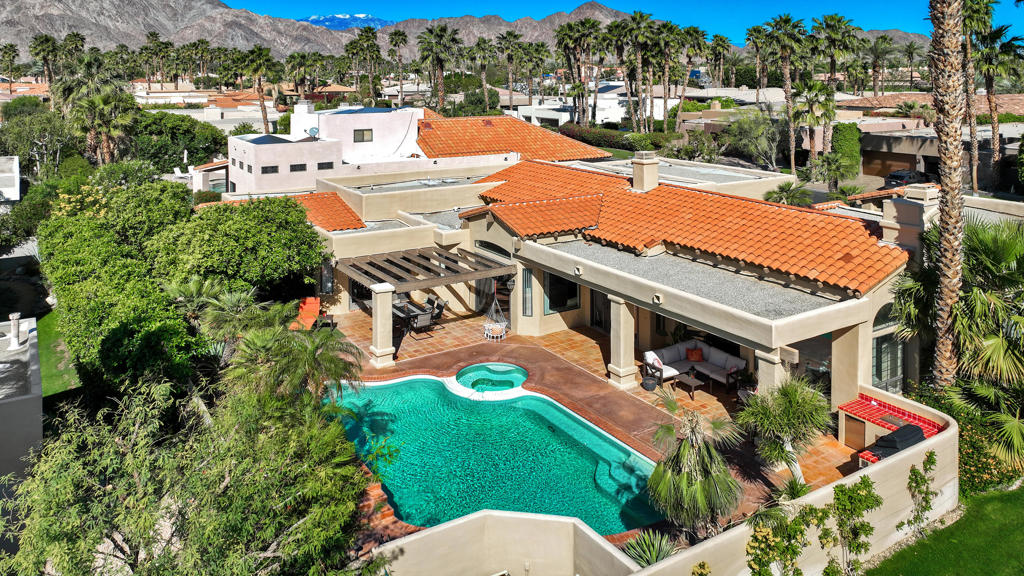 Price Improvement. Welcome to a beautifully designed 3-bedroom + bonus space/office, 5-bathroom home. Experience the timeless charm of Spanish design in this unique adobe-style Ministrelli-built home located in the highly desirable Painted Cove community of La Quinta. Situated on a quiet corner lot, this residence showcases authentic architectural character with exposed beam ceilings, textured finishes, and a stunning fireplace that creates a warm and inviting focal point in the living room.Step inside and discover a layout designed for both comfort and style. The home's unique character is felt throughout, offering the kind of craftsmanship and detail rarely found in newer construction. The spacious living areas flow effortlessly to the outdoors, where you'll find a private backyard retreat--perfect for entertaining, relaxing, or enjoying the peaceful desert lifestyle.Mature landscaping surrounds the property, creating a serene atmosphere in one of La Quinta's most picturesque gated communities. Whether you're seeking a full-time residence or a desert getaway, this home captures the essence of Spanish-style architecture with all the charm and character that makes it truly special. Enjoy low HOA fees and an amazing community green space where the neighborhood comes together in a pet friendly environment. Homes like this don't come on the market often. This is a must-see to fully appreciate its design, character, and location. Enjoy the quiet of the Painted Cove neighborhood while being just minutes away from world-class golf, dining, shopping, and all the best that La Quinta has to offer.