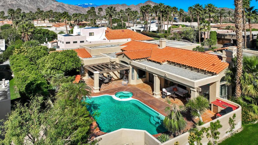 Price Improvement. Welcome to a beautifully designed 3-bedroom + bonus space/office, 5-bathroom home. Experience the timeless charm of Spanish design in this unique adobe-style Ministrelli-built home located in the highly desirable Painted Cove community of La Quinta. Situated on a quiet corner lot, this residence showcases authentic architectural character with exposed beam ceilings, textured finishes, and a stunning fireplace that creates a warm and inviting focal point in the living room.Step inside and discover a layout designed for both comfort and style. The home's unique character is felt throughout, offering the kind of craftsmanship and detail rarely found in newer construction. The spacious living areas flow effortlessly to the outdoors, where you'll find a private backyard retreat--perfect for entertaining, relaxing, or enjoying the peaceful desert lifestyle.Mature landscaping surrounds the property, creating a serene atmosphere in one of La Quinta's most picturesque gated communities. Whether you're seeking a full-time residence or a desert getaway, this home captures the essence of Spanish-style architecture with all the charm and character that makes it truly special.  Enjoy low HOA fees and an amazing community green space where the neighborhood comes together in a pet friendly environment.  Homes like this don't come on the market often. This is a must-see to fully appreciate its design, character, and location. Enjoy the quiet of the Painted Cove neighborhood while being just minutes away from world-class golf, dining, shopping, and all the best that La Quinta has to offer.